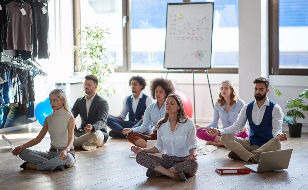 People meditating encouraging corporate wellness